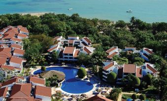 aerial view of a resort surrounded by water , with multiple buildings and a large pool visible at Sunscape Puerto Plata All Inclusive