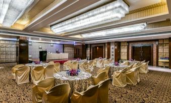 a large banquet hall with multiple tables and chairs set up for a formal event at The Regenza by Tunga