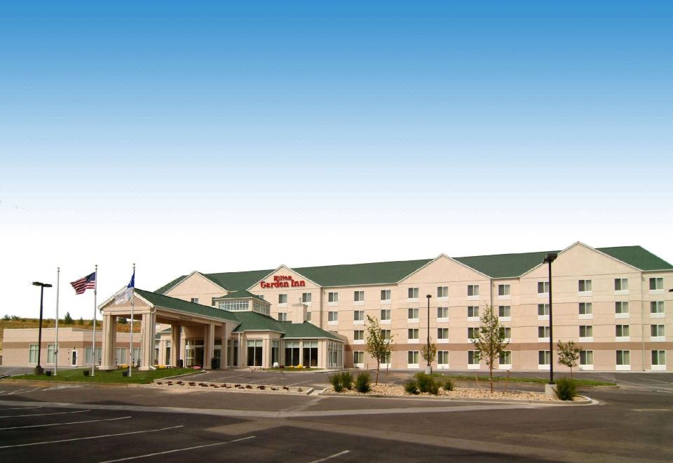 "a large hotel with a red roof and the name "" innsbrook inn & suites "" is shown" at Hilton Garden Inn Casper