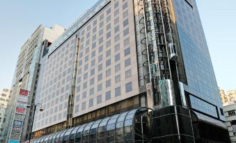 "A large building with an exterior view and the word ""hotel"" displayed on top is located in front" at Prudential Hotel
