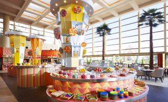 a large buffet table filled with a variety of candies and desserts in a room at Sheraton Grande Tokyo Bay Hotel