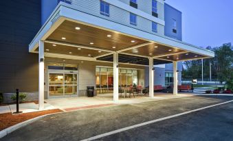 a hotel entrance with a large glass door and a covered area on the side at Home2 Suites by Hilton Walpole Foxboro