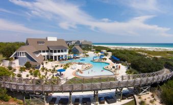 a large resort with a pool and beach area is shown from an aerial view at WaterSound Inn