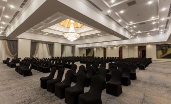 a large , empty conference room with rows of black chairs arranged in an orderly fashion at Jolie Ville Hotel & Spa Kings Island Luxor