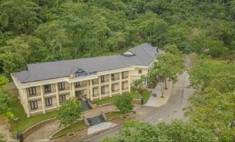 "a large building with the word "" chubb "" written on it , surrounded by trees and other buildings" at Saigon-Ba Be Resort