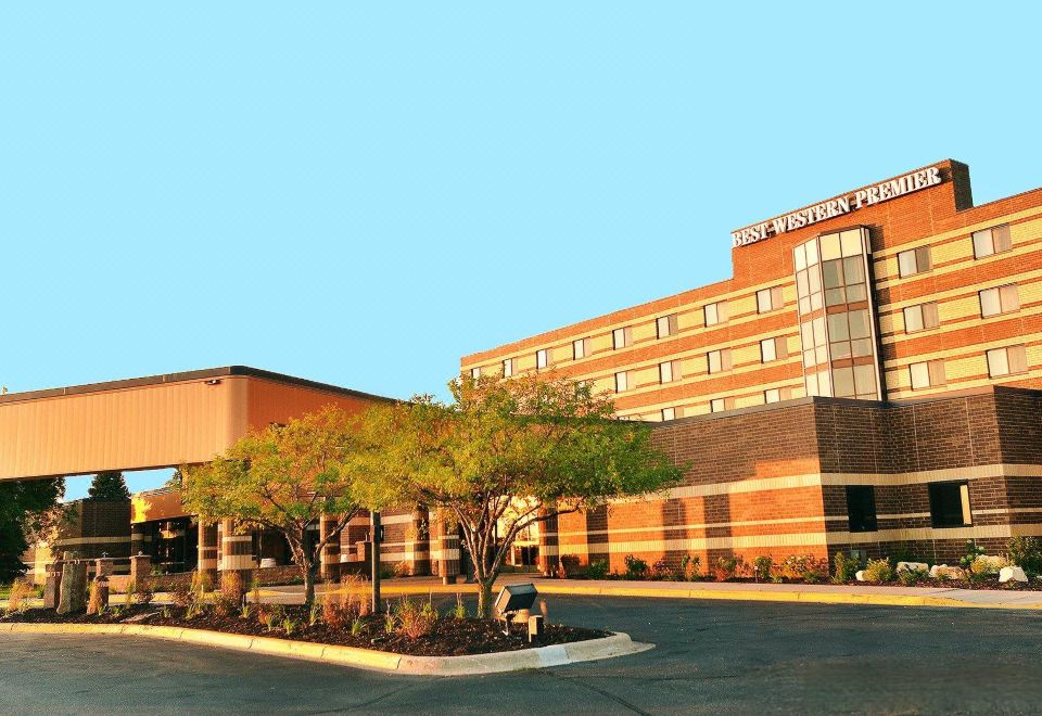 "a large brick building with the word "" edwigon "" written on it , surrounded by trees and a parking lot" at Wyndham Minneapolis South/Burnsville