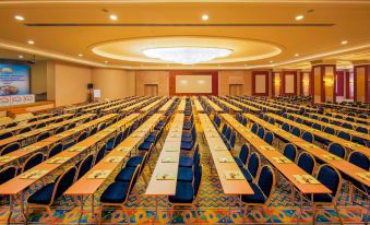 a large conference room filled with rows of chairs and tables , ready for a meeting or event at Horus Paradise Luxury Resort - All Inclusive