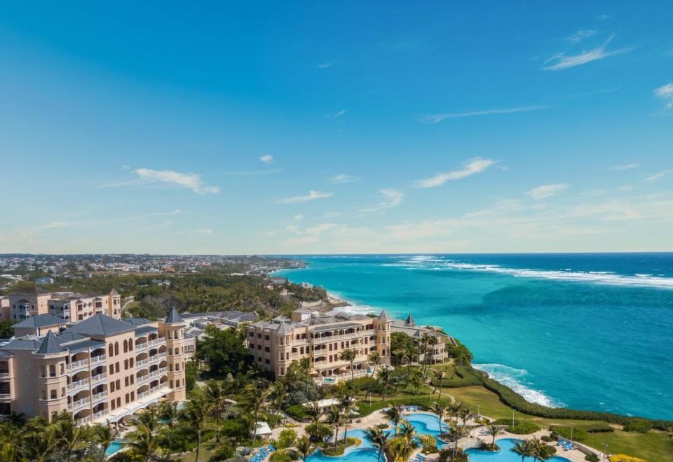 a bird 's eye view of a resort with a pool and ocean in the background at The Crane Resort