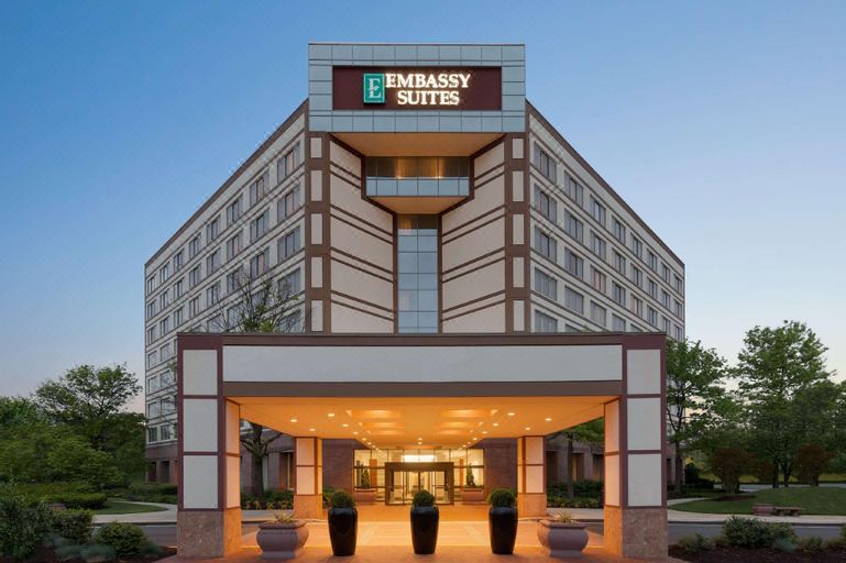 the entrance of the embassy suites hotel , with its name displayed prominently above the doorway at Embassy Suites by Hilton Baltimore at BWI Airport