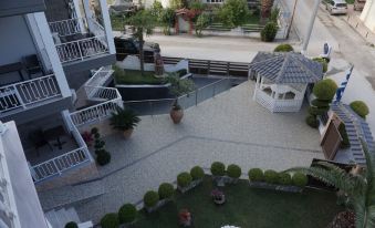a bird 's eye view of a courtyard with a gazebo and stairs leading up to it at Paradise