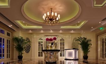 The large room features chandeliers and marble floors, along with an ornate reception area at Sofitel Guangzhou Sunrich