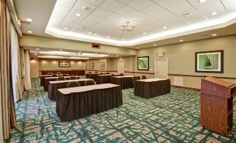 a conference room set up for a meeting , with chairs arranged in rows and a table in the center at Homewood Suites by Hilton Tampa-Port Richey
