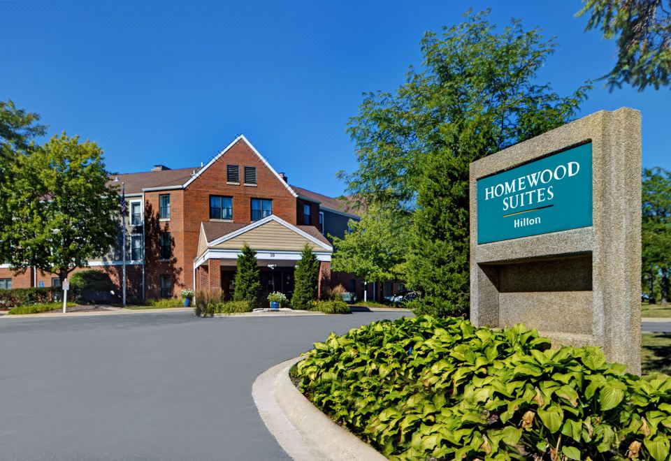 "a large brick building with a sign that reads "" homewood suites "" in front of it" at Homewood Suites by Hilton Chicago-Lincolnshire