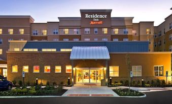 the entrance to a residence inn by marriott hotel is lit up with a large sign above the door at Residence Inn Riverside Moreno Valley