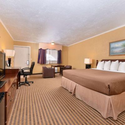 Standard Queen Room Executive Plus Inn & Suites Promo Code