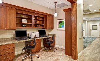 a room with two desks , one on the left side and the other on the right side at Homewood Suites by Hilton Tampa-Port Richey