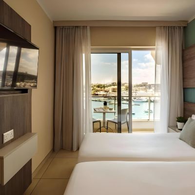Standard Double or Twin Room 115 the Strand Hotel & Suites by Neu Collective Promo Code