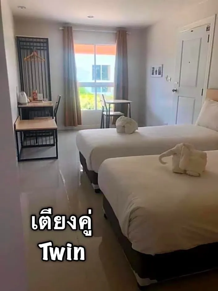 ห้องมาตรฐานเตียงแฝดพร้อมวิวสวนหย่อม