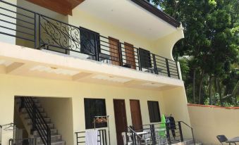 A house with stairs and balconies is located at an apartment complex in Kla at Joaquim's Lodge