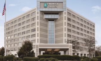"a large hotel building with a sign that reads "" embassy suites "" prominently displayed on the front" at Embassy Suites by Hilton Baltimore at BWI Airport