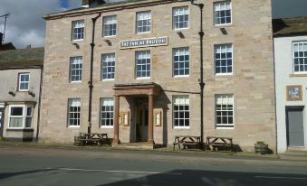 "a brick building with large windows and a sign that reads "" the inn at brogan "" is shown" at The Inn at Brough