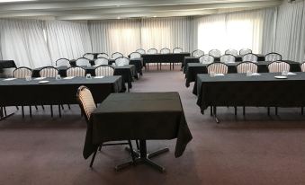 a conference room with tables and chairs arranged in rows , ready for a meeting or event at Castaways Resort