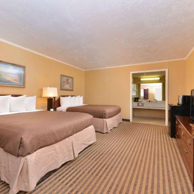 Deluxe Room-2 Queen Beds Executive Plus Inn & Suites Promo Code