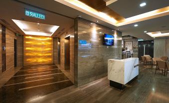 The luxury hotel features a main room lobby with wood-paneled walls and an elevator at Hotel Transit Kuala Lumpur