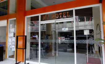 "a modern hotel entrance with a large glass door and the name "" m hotel "" displayed above it" at My Hotel