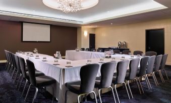 a conference room with a long table and chairs arranged for a meeting or event at The Fontaine