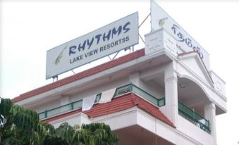 "a building with a large sign that reads "" rhythms lake view resorts "" prominently displayed on it" at Rhythm