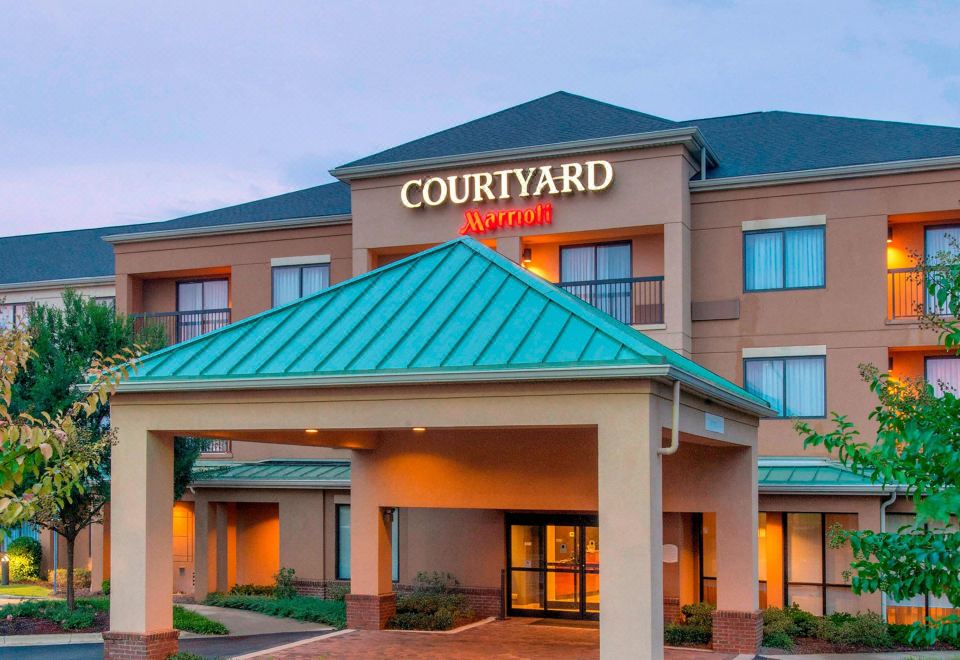 a courtyard by marriott hotel with its name displayed prominently , under the sign of the hotel at Courtyard by Marriott Montgomery Prattville