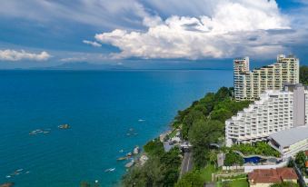 aerial view of a city by the ocean , with a tall building in the background at DoubleTree Resort by Hilton Hotel Penang