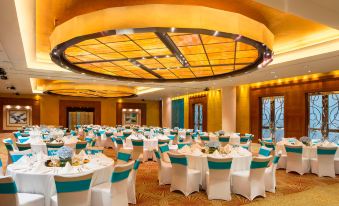 The hotel offers a spacious ballroom equipped with tables and chairs, suitable for hosting events and functions at The Westin Bund Center Shanghai