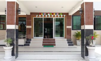 "the entrance of a building with a sign that reads "" ar 3 young "" above the door" at Phetlada Pavilion & Resort