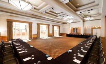 a large conference room with multiple tables and chairs arranged for a meeting or event at Hyatt Hotel Canberra - A Park Hyatt Hotel
