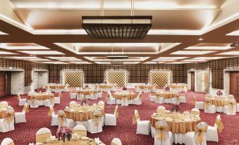 a large banquet hall with multiple tables and chairs arranged for a formal event , possibly a wedding reception at Hyatt Centric Janakpuri New Delhi