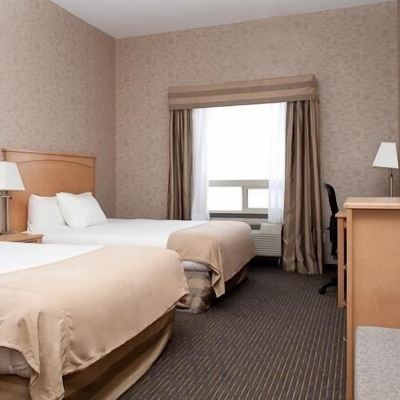 2 Queen Beds Room, Non-Smoking Paradise Inn and Suites Promo Code