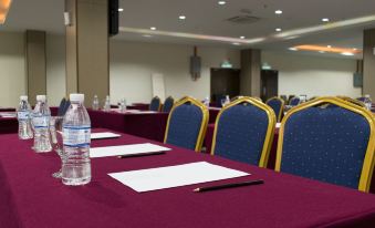 a conference room set up for a meeting , with chairs arranged in rows and a table in the center at Marina Island Pangkor Resort & Hotel