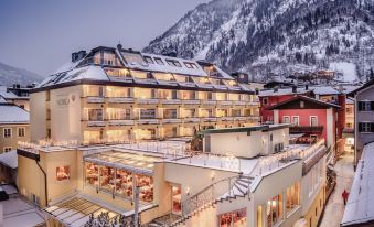 Hotel Norica - Thermenhotels Gastein mit dem Bademantel direkt in die Therme - Housity