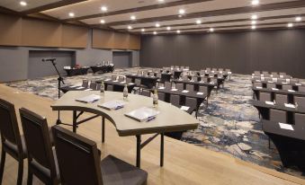 a large conference room with multiple rows of tables and chairs arranged for a meeting at Royalton Negril, An Autograph Collection All-Inclusive Resort