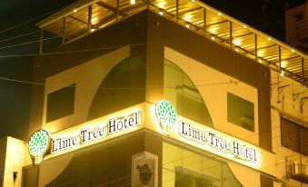 "a large building with a sign that reads "" lima tree hotel "" prominently displayed on the front of the building" at Lime Tree Hotel