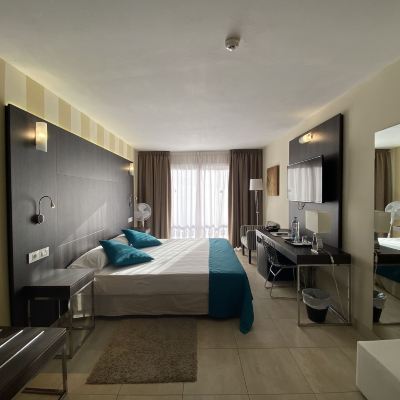 Deluxe Room (2 Adults + 1 Child) La Aldea Suites Promo Code