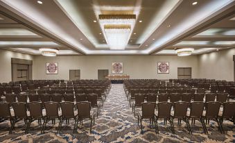 a large conference room with rows of chairs arranged in a semicircle , ready for an event at Grand Hyatt Vail