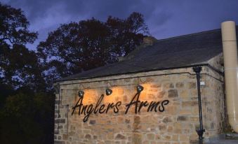 "a brick building with the words "" anglers arms "" written on it , illuminated by multiple lights" at Anglers Arms