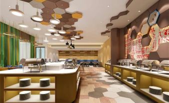The restaurant features spacious tables and chairs, complemented by an art deco design on the ceiling at Ibis Styles Hotel (Beijing Capital Airport)