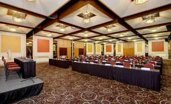 A spacious ballroom is set up with rows of tables for an event or function at Anew Hotel Parktonian Johannesburg