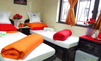 The room with two clean beds and pillows on top is well-maintained, but there are also other options available at Hong Kong Budget Hostel