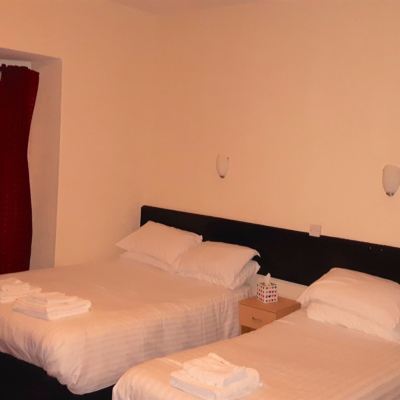 Family Room with Shared Bathroom Trinity Guest House Promo Code