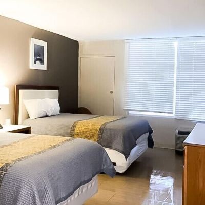 Deluxe Room, 2 Double Beds, Non Smoking APM Inn & Suites Promo Code